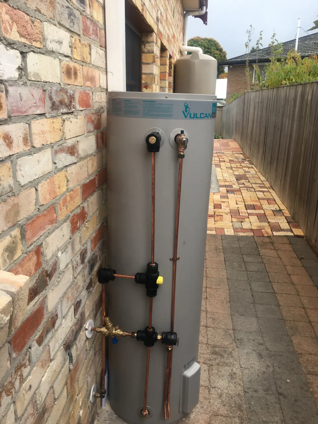 New Vulcan electric storage hot water system with copper pipework installed by Gold Coast Budget Plumbing